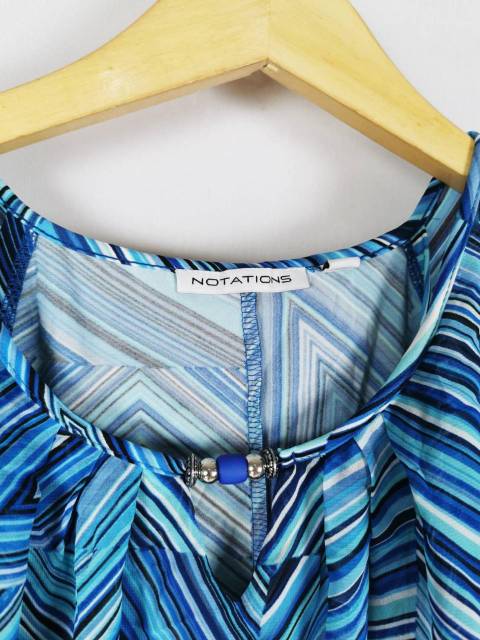 Nottion's blue geo print cape ruffled blouse